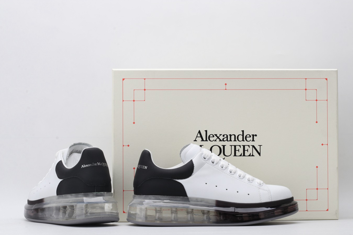 AMQ white oversized sneakers with black heel